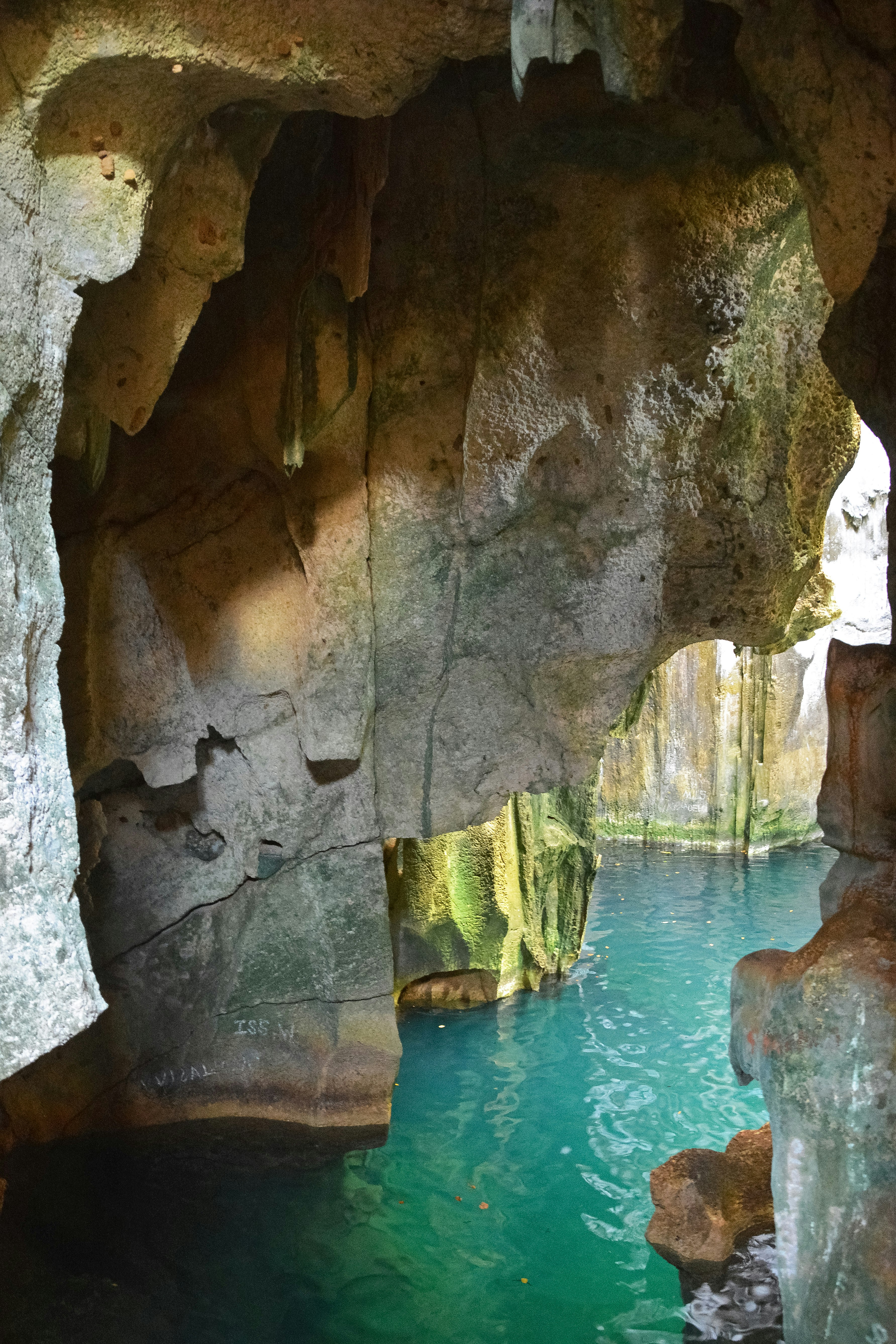 brown rock formation near body of water during daytime